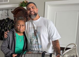 Saskatchewan Roughriders celebrate Grey Cup with Angie Reed, late George Reed’s wife